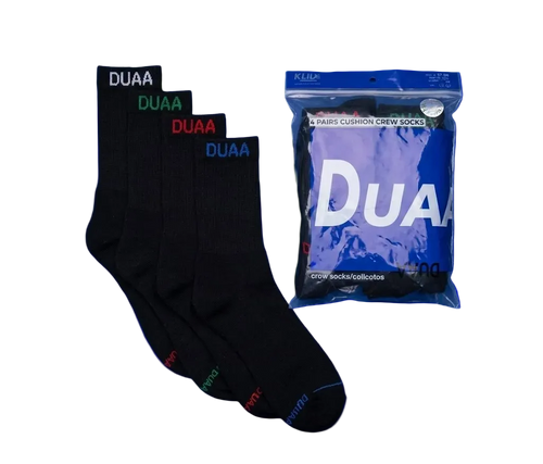 Four pairs of black crew socks with colorful DUAA branding in white, green, red, and blue, shown next to their blue packaging bag on a white background.