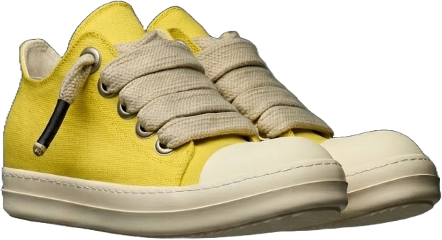 Yellow DUAA sneaker with beige laces on a white background
