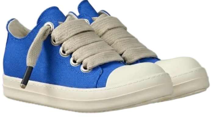 A pair of DUAA low-top canvas sneakers in vibrant blue with thick, textured beige laces, cream rubber toe caps, and off-white soles, shown against a plain white background.